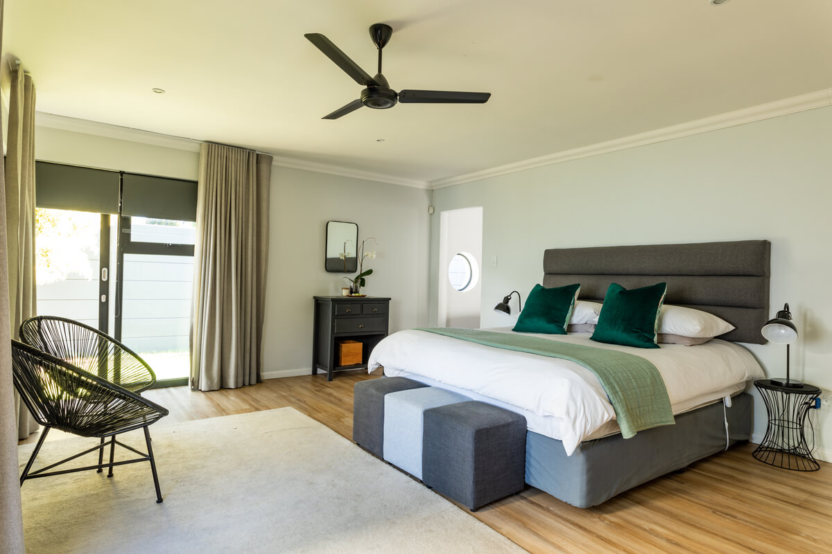 chairs-and-bed-with-furniture-in-bedroom-at-home-Q4GA9GC.jpg