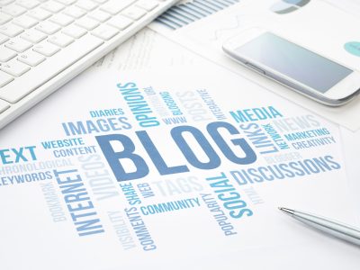 Blog concept cloud chart print document, keyboard, pen and smartphone.